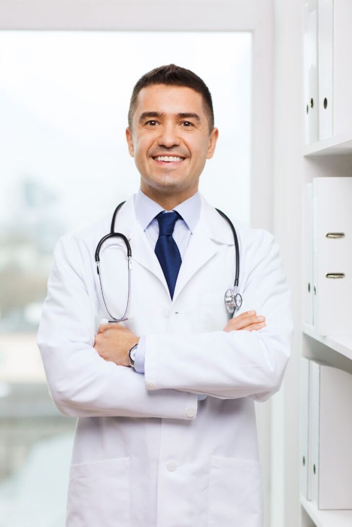 A male doctor with his arms crossed